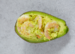 Stuffed avocado with garlic, eggs and shrimps